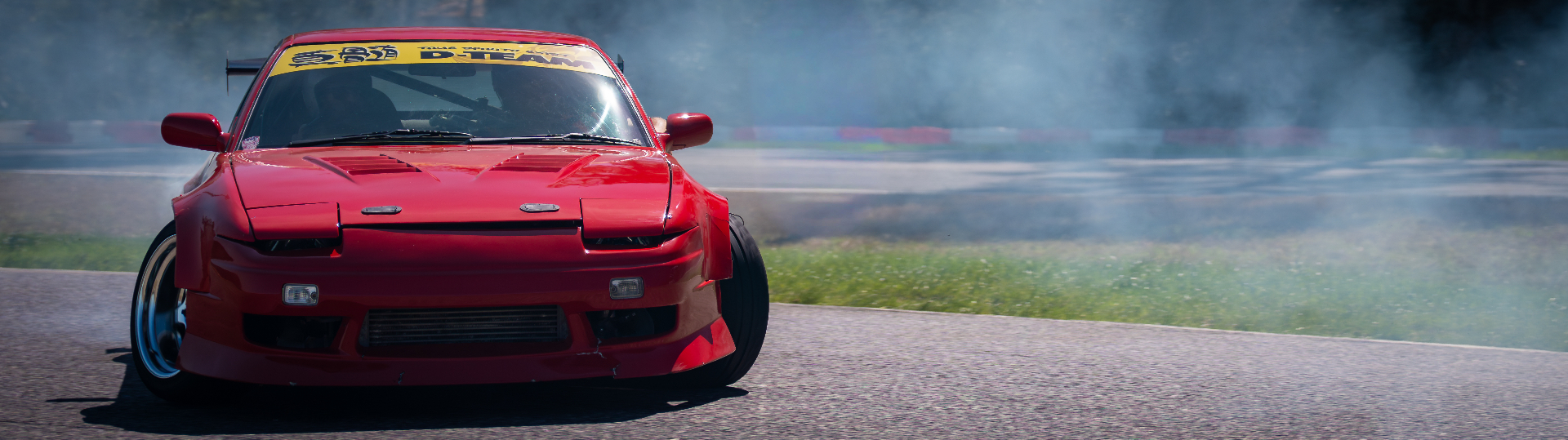 Red S13 drifting with tire smoke