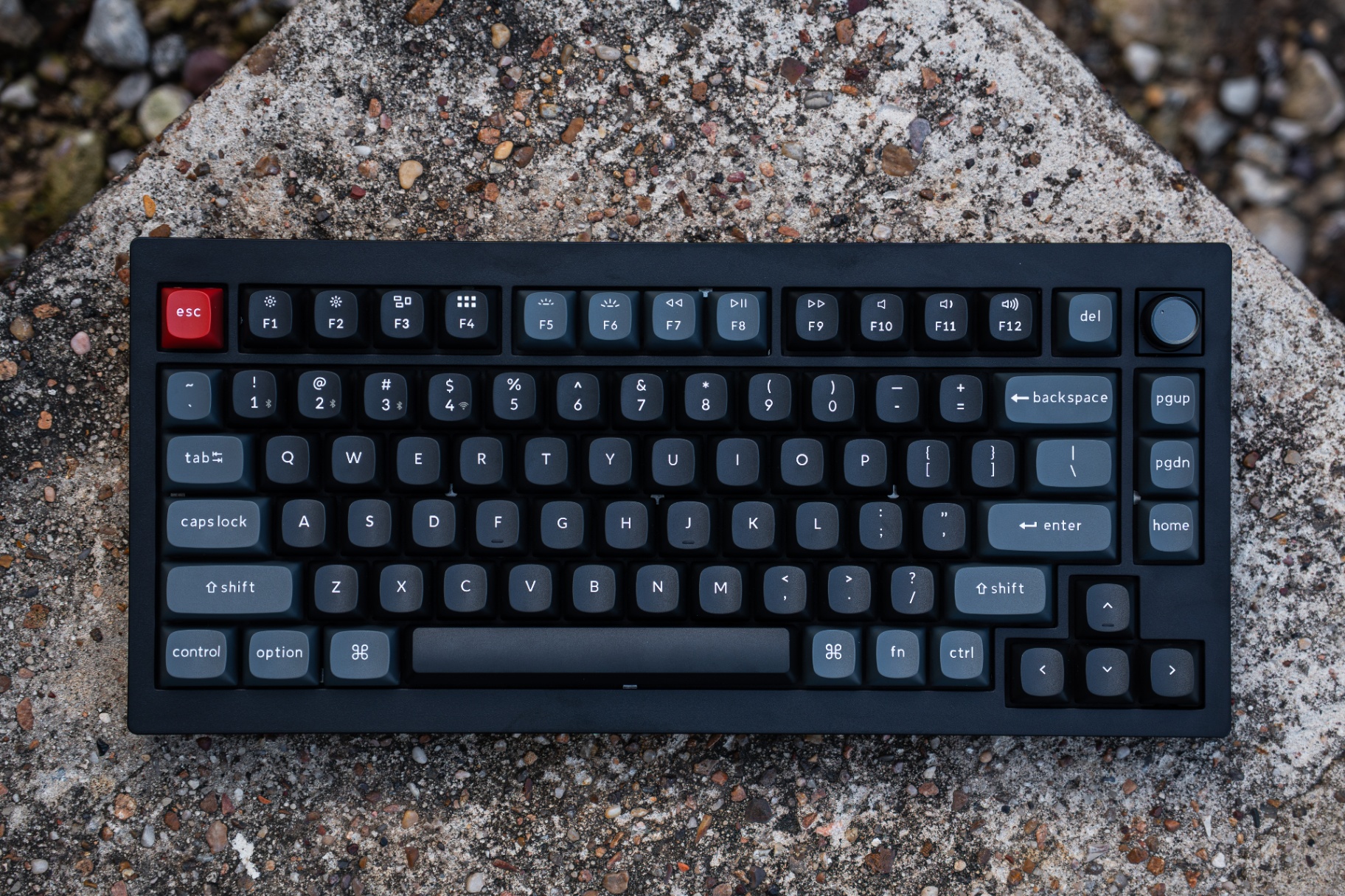 Keychron V1 mechanical keyboard with red esc keycap on stone